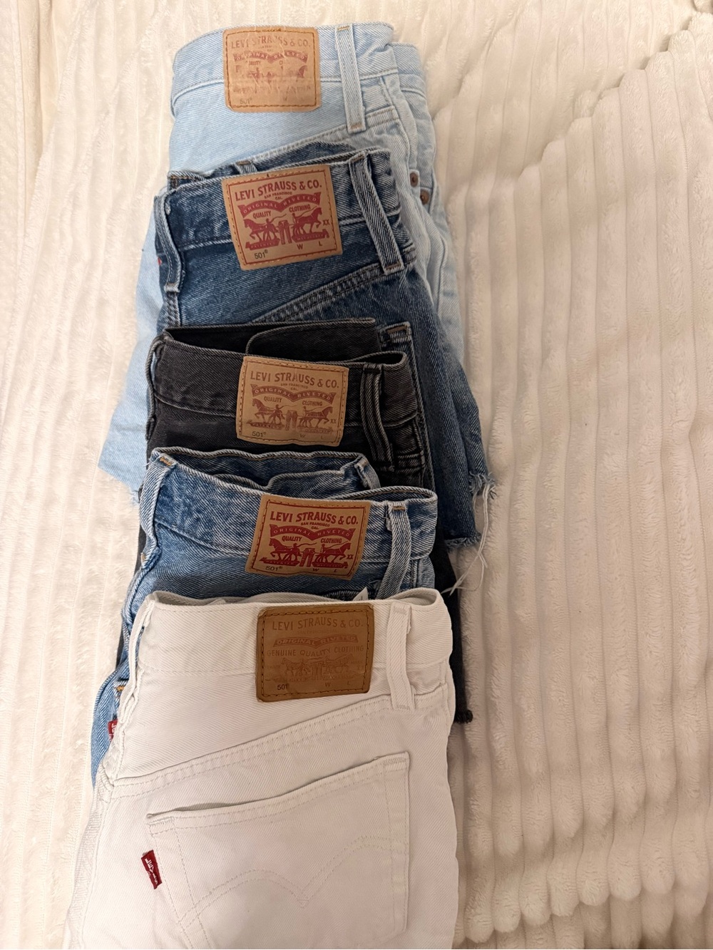 Levi's Assorted Denim Stack — White, Light Blue, Medium Blue, Dark Blue, Black